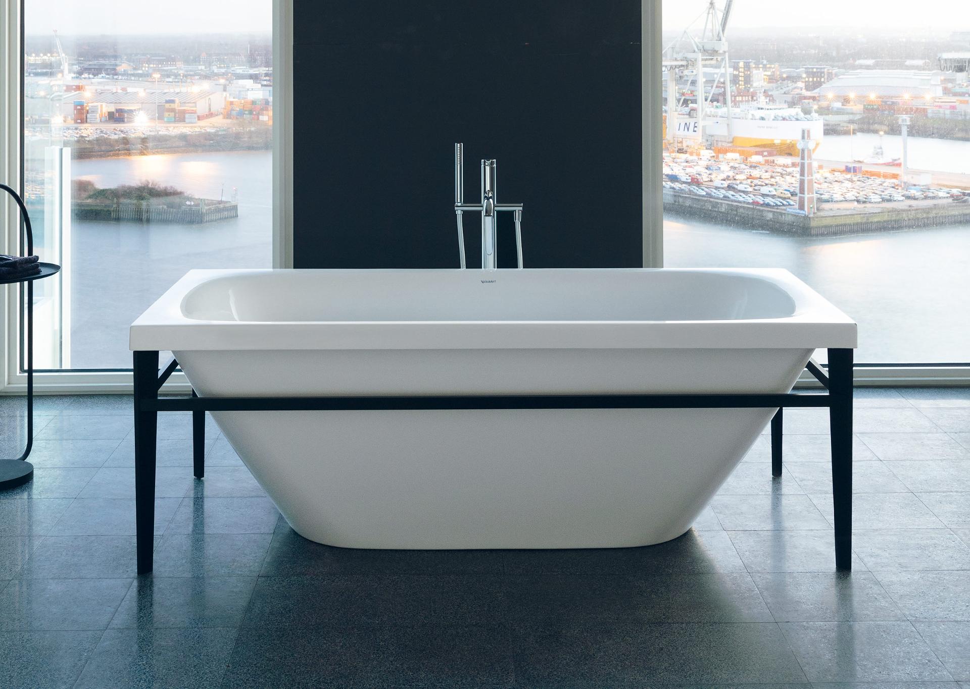 Freestanding Xviu bathtub in front of window
