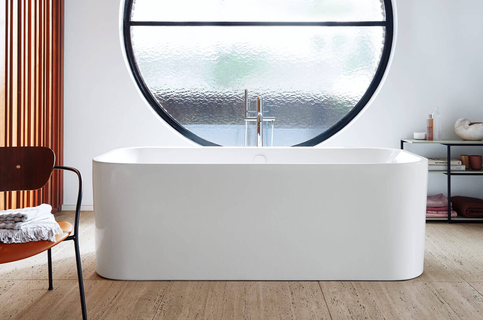 Freestanding Happy D.2 Plus bathtub in front of window
