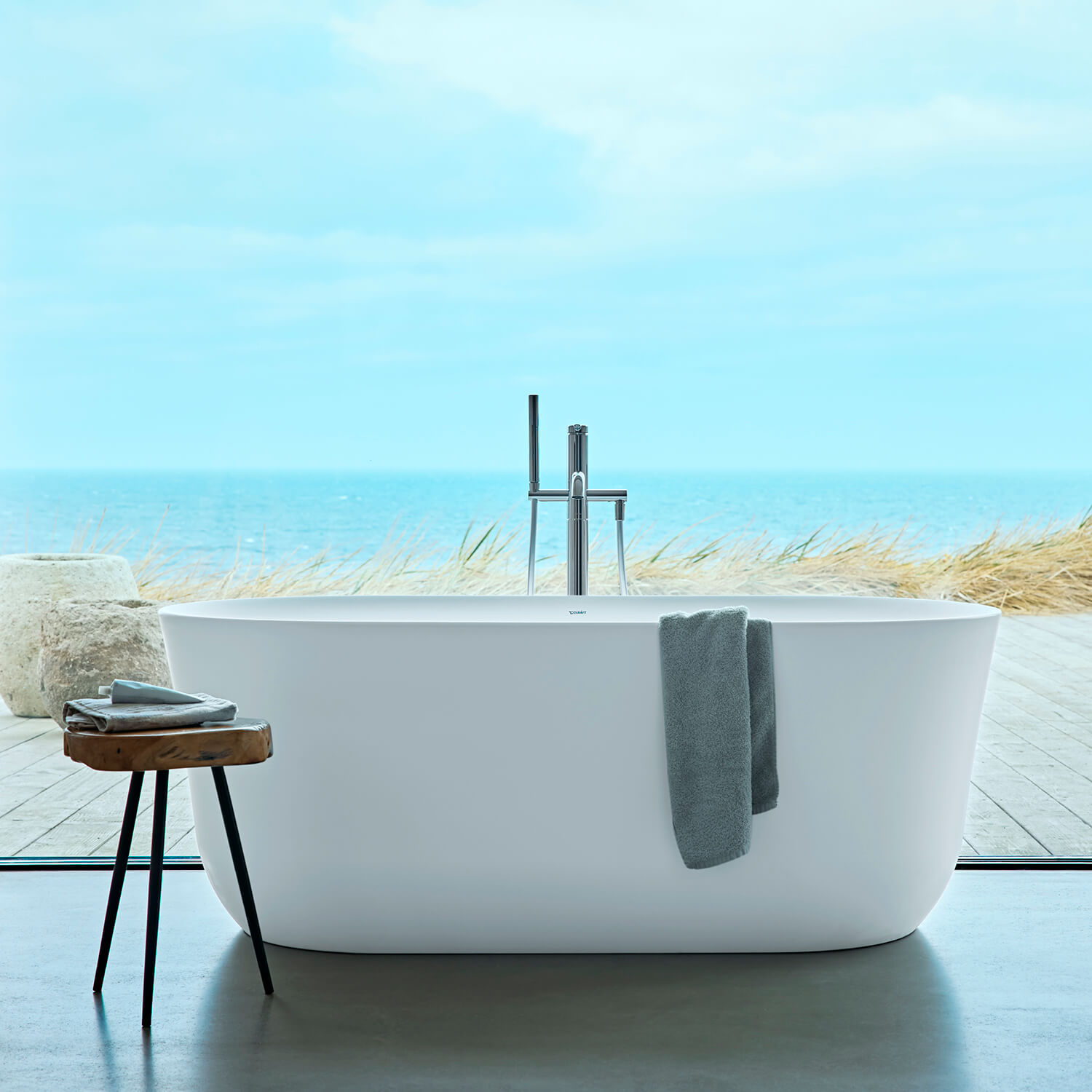 Free standing Soleil bathtub in front of window
