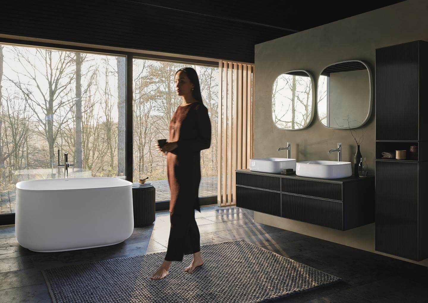 Woman in Bathroom with Zencha bathtub and furnitures
