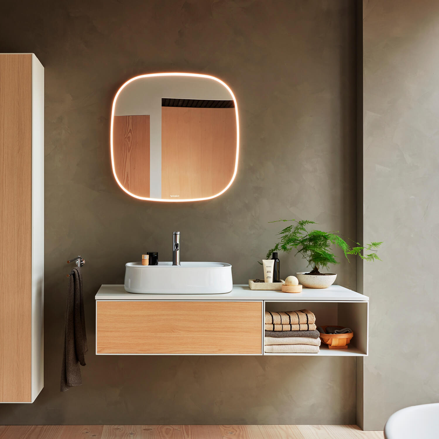 Zencha vanity unit wall mounted in front of mirror
