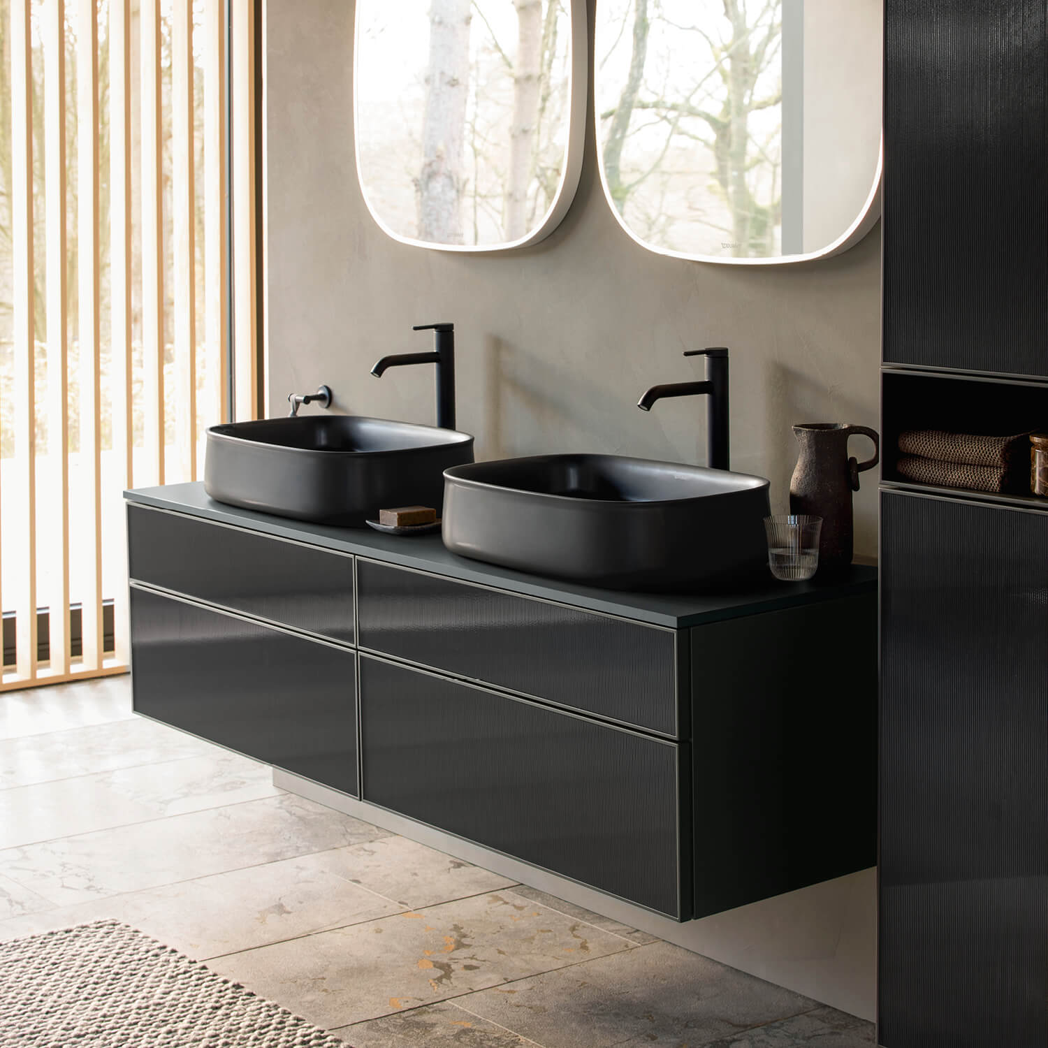 Black Zencha washbasin in front of mirror
