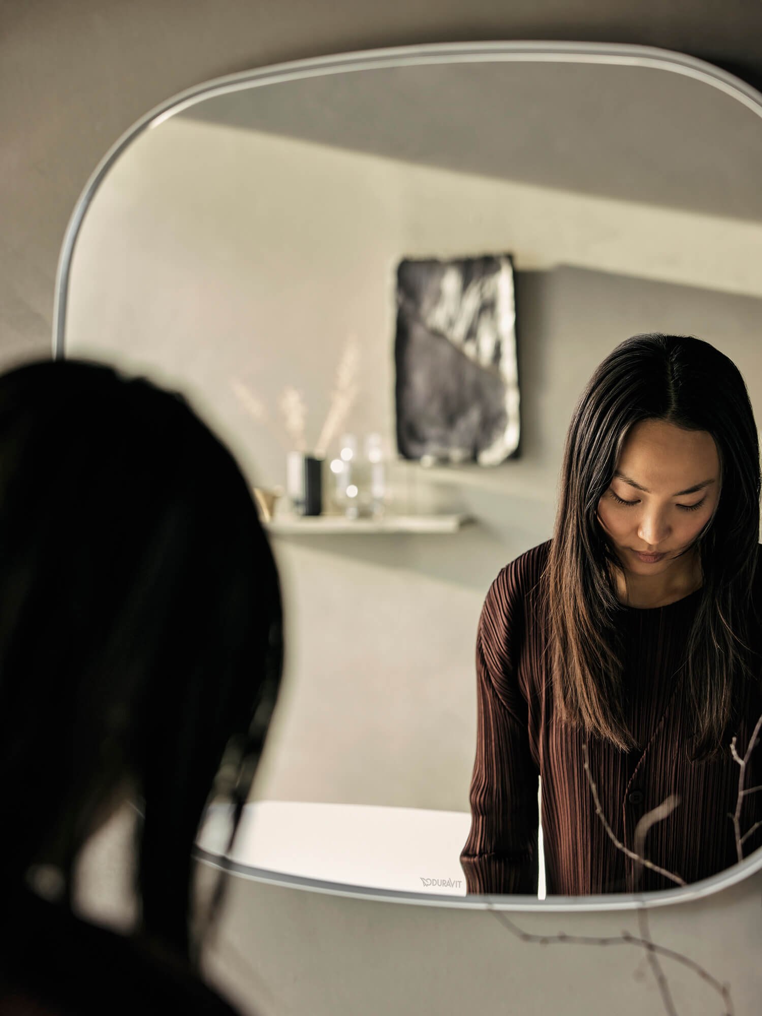 Woman in front of a zencha mirror
