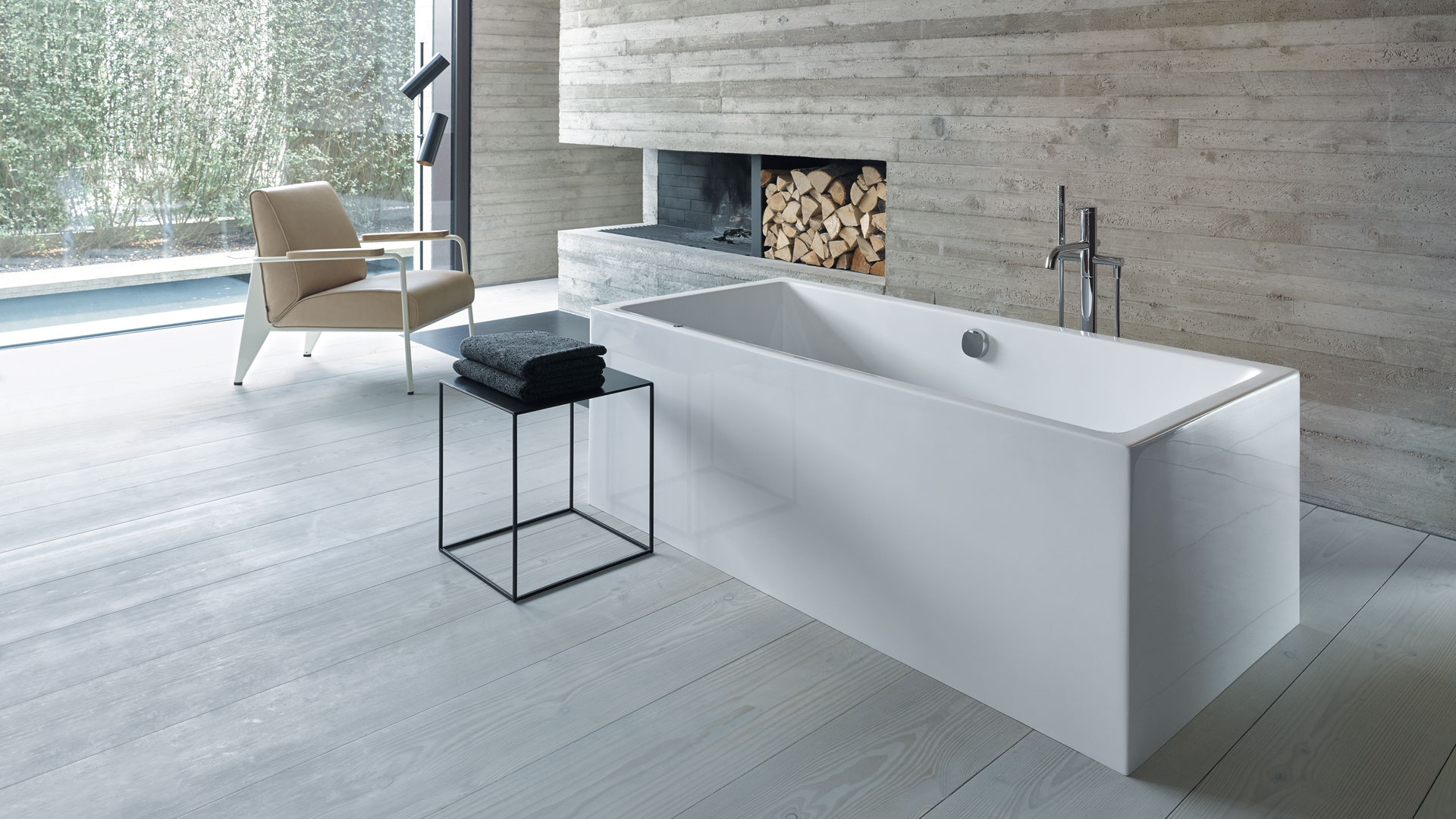 Open bathroom with fireplace and freestanding bathtub
