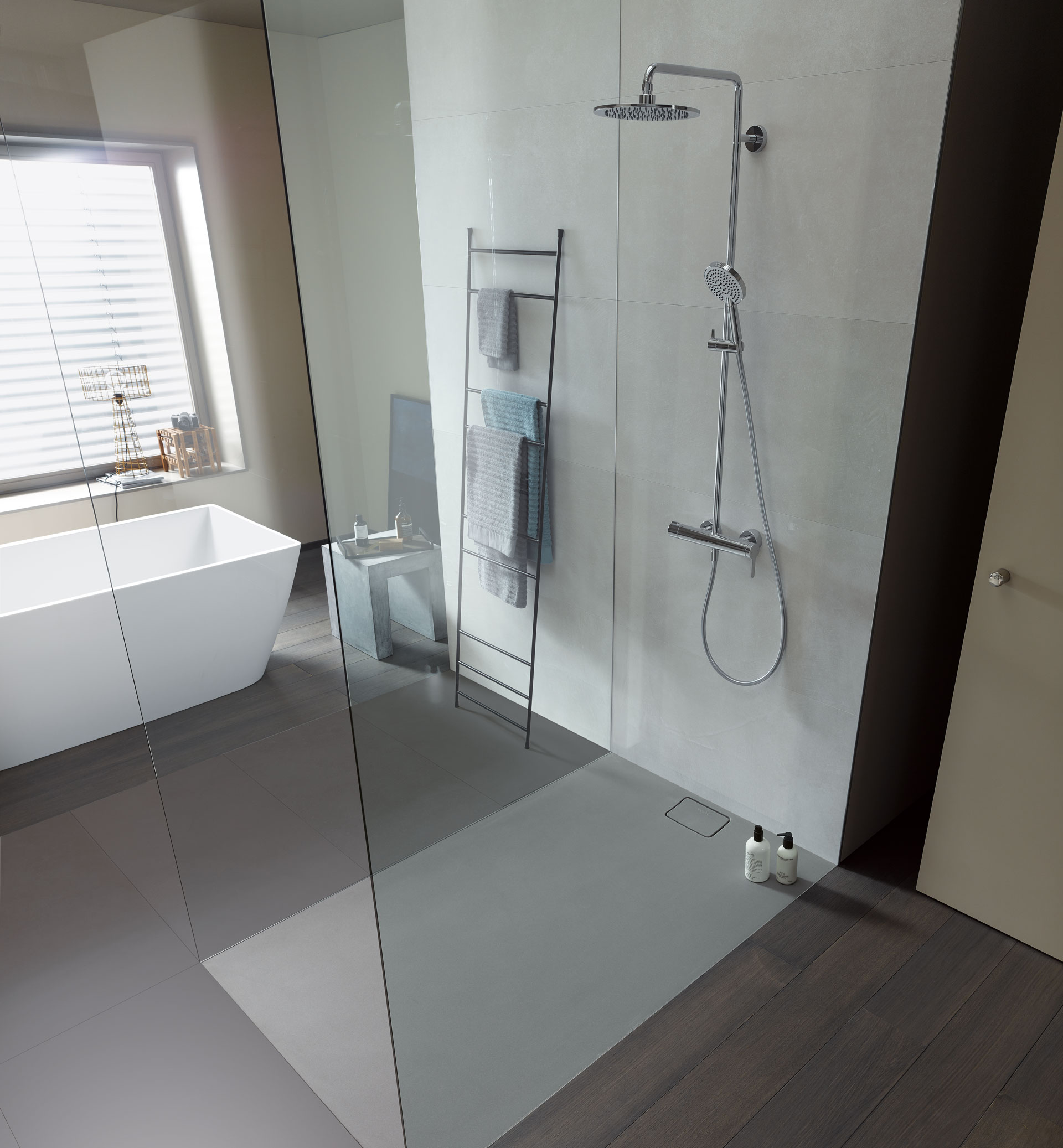 Large walk-in Stonetto shower with glass walls
