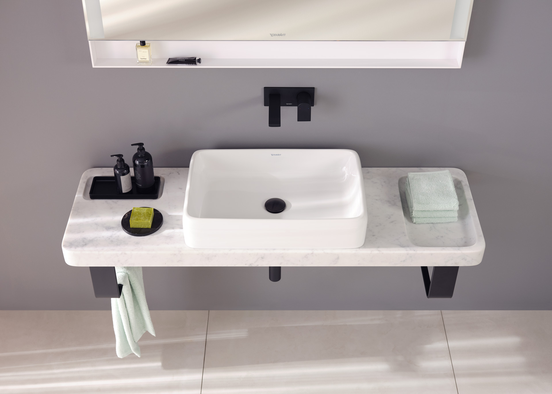 Stone console with matching Qatego countertop sink
