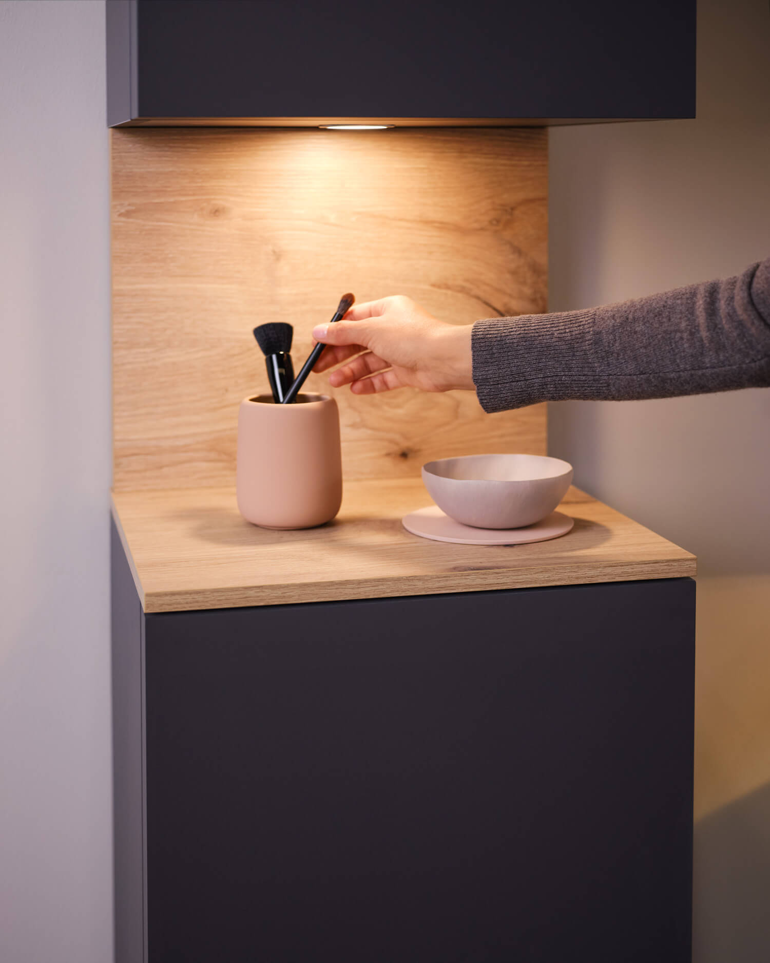 Bathroom furniture with open compartments and optional lighting
